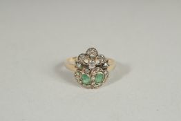A 9CT GOLD EMERALD AND DIAMOND SWEETHEART RING.