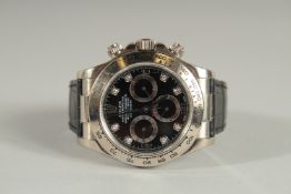 AN 18CT WHITE GOLD DAYTONA ROLEX OYSTER PERPETUAL WRIST WATCH with leather strap, black face, set
