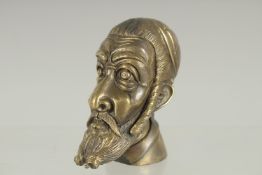 A NOVELTY BRASS MAN'S HEAD VESTA. 2.25ins high.