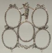 A GOOD FIVE SECTION PHOTOGRAPH FRAME with a cupid. 3.5ins x 3.5ins.