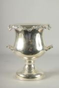 A GOOD PAIR OF PLATED TWO HANDLED URN SHAPED WINE COOLERS. 12ins high.