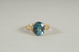 AN 18CT GOLD SAPPHIRE RING with diamond shoulders.