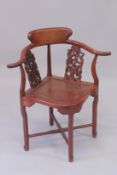 A CHINESE HARDWOOD ARMCHAIR with carved painted splats