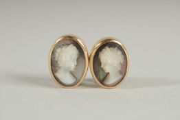 A PAIR OF 18CT GOLD AND MOTHER OF PEARL EARRINGS.
