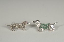 TWO SILVER DACHSHUNDS BROOCHES.