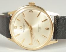 A 14CT GOLD UNIVERSE AUTO WRIST WATCH 28 with leather strap.