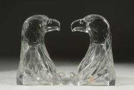 A PAIR OF GLASS EAGLE BOOK ENDS.