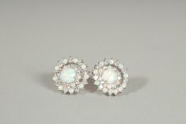 A PAIR OF SILVER, OPAL AND CZ CLUSTER EARRINGS.