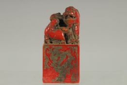 A CHINESE RED SQUARE DRAGON SEAL 4ins high.