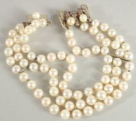 AN 18CT WHITE GOLD TRIPLE ROW PEARL BRACELET.