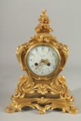 A GOOD 19TH CENTURY FRENCH ORMOLU ROCOCO CLOCK with circular dial by Suisse Freres, Paris.