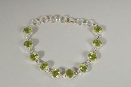 A SILVER PERIDOT BRACELET.