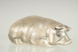 A RUSSIAN SILVER SLEEPING PIG. Mark: Head 84 Faberge I. P.. 2.5ins long.
