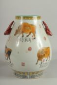 A CHINESE DEER HANDLE VASE painted with cattle and calligraphy. 13ins high.