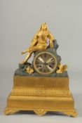 A GOOD EMPIRE ORMOLU AND BRONZE CLOCK the case with a single gilded figure. 13ins high.