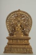A GOOD GILT BRONZE BUDDHA with halo, on a rectangular base. 11ins high.