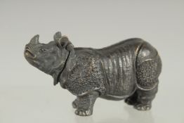 A NOVELTY BRASS RHINO VESTA. 2.5ins long.