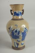 A CHINESE CRACKLE GLAZE AND BLUE PO0RCELAIN VASE. 16ins high.