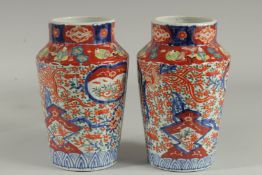 A PAIR OF IMARI VASES. 9.5ins high.