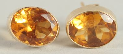 A PAIR OF YELLOW GOLD CITRINE STUDS.