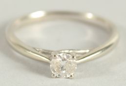 AN 18CT WHITE GOLD SINGLE STONE RING.