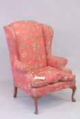 A PINK WING ARM CHAIR with tapestry cover with wild animals, on cabriole legs.