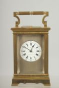 A GOOD 19TH CENTURY BRASS CARRIAGE CLOCK with column supports.
