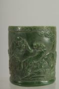 A CHINESE CARVED JADE CIRCULAR BRUSH POT. 5ins.