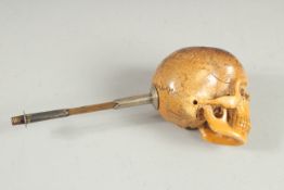 A RARE POSSIBLY 18TH CENTURY CARVED AND INSCRIBED SKULL PIPE. Skull 1.75ins long, 1.75ins wide, 1.