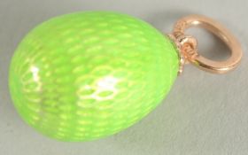 A 14CT GOLD EGG PENDANT.