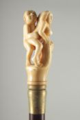 A BONE HANDLE WALKING STICK 'EROTIC'.
