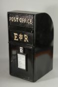 A BLACK REPLICA TIN POST BOX. 25ins high.