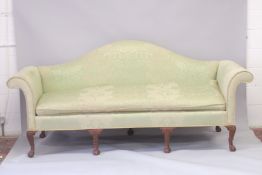 A LARGE MAHOGANY CAMEL BACK SOFA on claw and ball feet. 8ft long.
