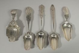FIVE VARIOUS SILVER CADDY SPOONS.