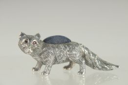 A NOVELTY SILVER FOX PIN CUSHION. 2.25ins long.