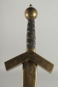 A GERMAN SWORD in a leather scabbard with brass pommel. Inventory No. 10.286. 41ins long.