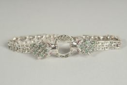 A SILVER EMERALD MARCASITE PANTHER BRACELET.