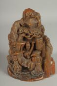 A CHINSES CARVED HORN GROUP with many figures. 7ins high.