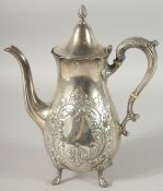 A STIRLING SILVER COFFEE POT with repousse decoration on four pad feet. 26ozs.