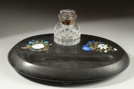 A DERBYSHIRE ASHFORD OVAL BLACK MARBLE INKSTAND with cut glass bottle, the stnad with pen well and