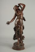 AUG MOREAU A GOOD BRONZE OF A YOUNG LADY with flowing hair. Signed on a circular base. 24ins high.