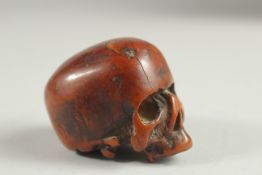 A RARE POSSIBLY 17TH CENTURY CARVED BONE SKULL. 2.25ins long, 1.5ins wide, 1.5ins high.