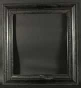 An early 20th Century Dutch ebonised ripple moulded frame, rebate size, 19.75