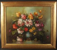 G. Itla (20th Century), A still life of mixed flowers in a vase, oil on canvas, signed, 20