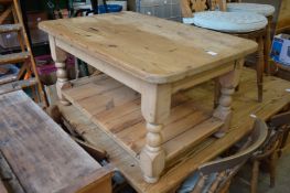 A pine two tier coffee table.