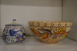 A Charlotte Rhead decorated pottery bowl together with a Poole pottery preserve jar.