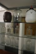 Glass terrarium, demijohns and other items.