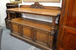 Victorian oak buffet with three panelled cupboard doors.