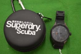 A Superdry Gents chronograph style wrist watch with original case.