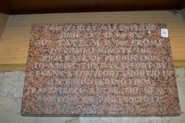 An engraved granite Commemorative plaque.